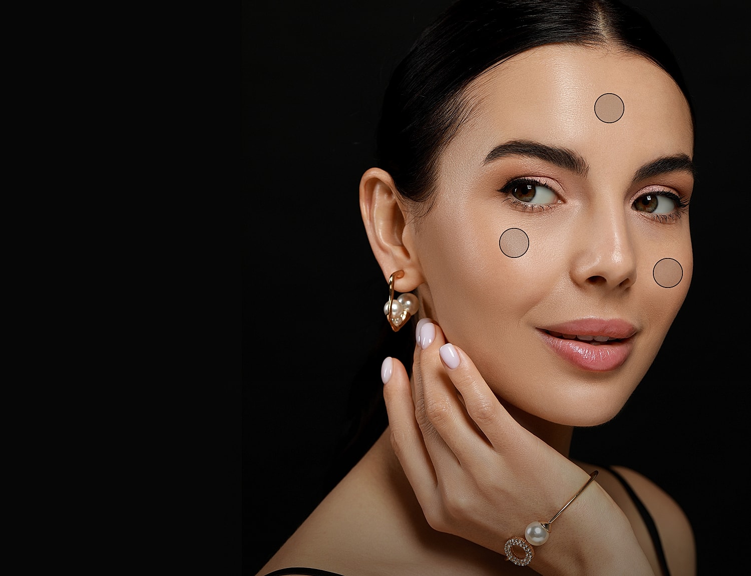 Model showcasing beauty makeup techniques on face.