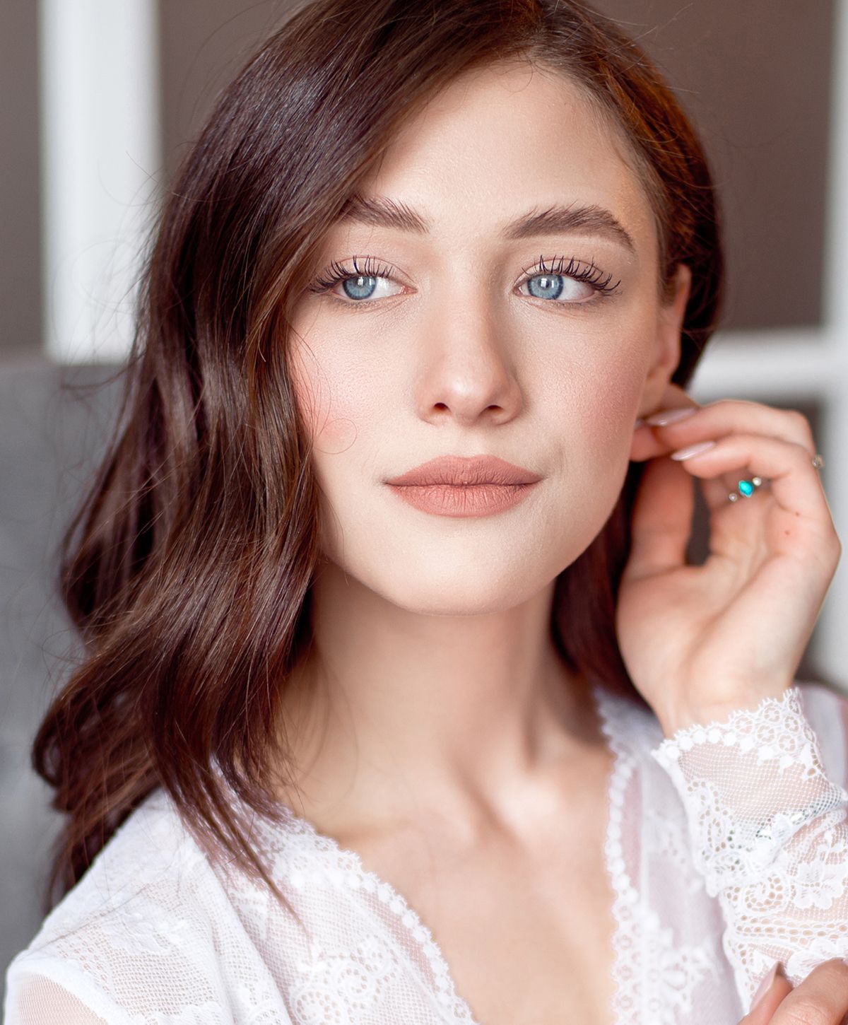 Young woman with long hair and blue eyes.