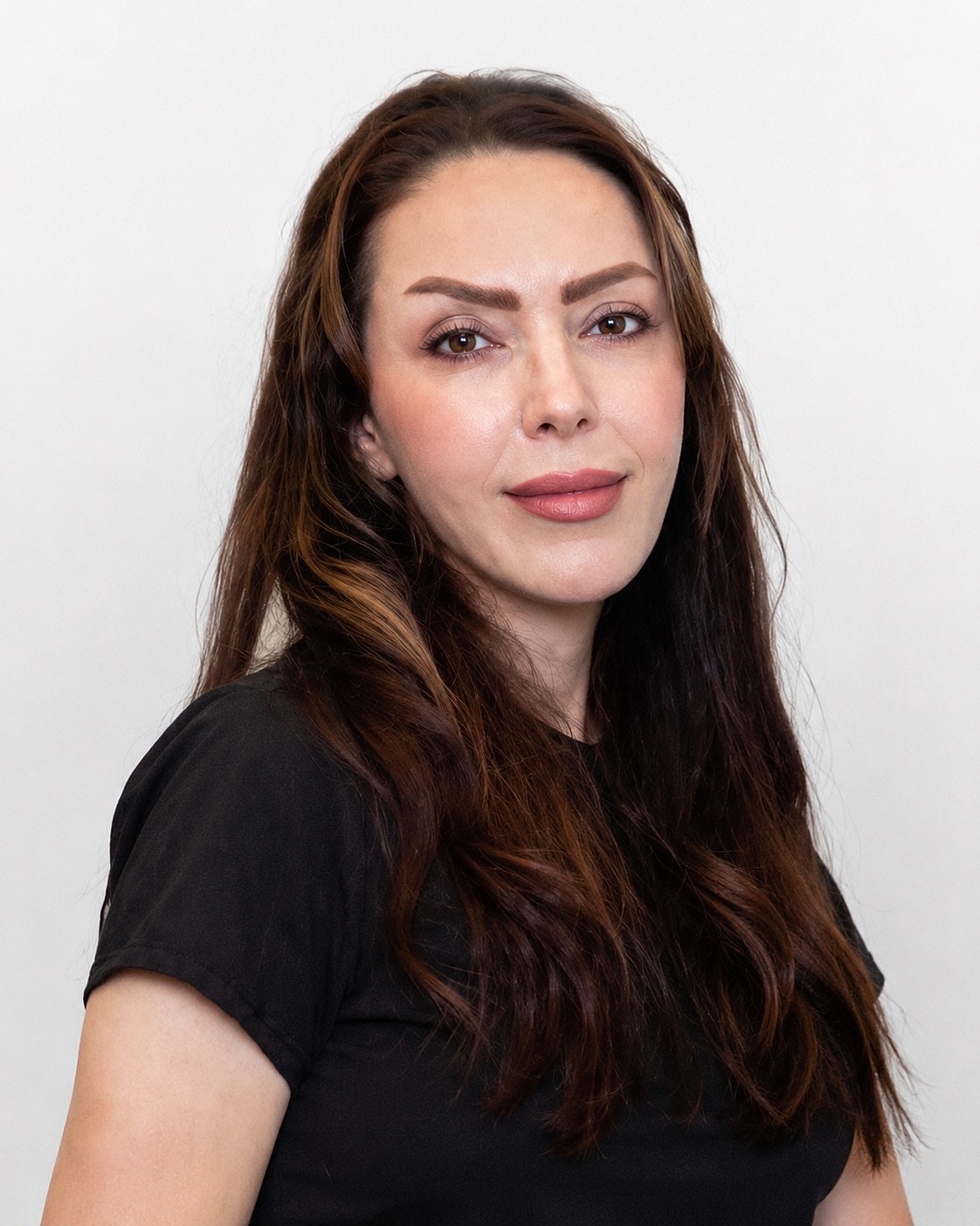 Portrait of a woman with long hair.