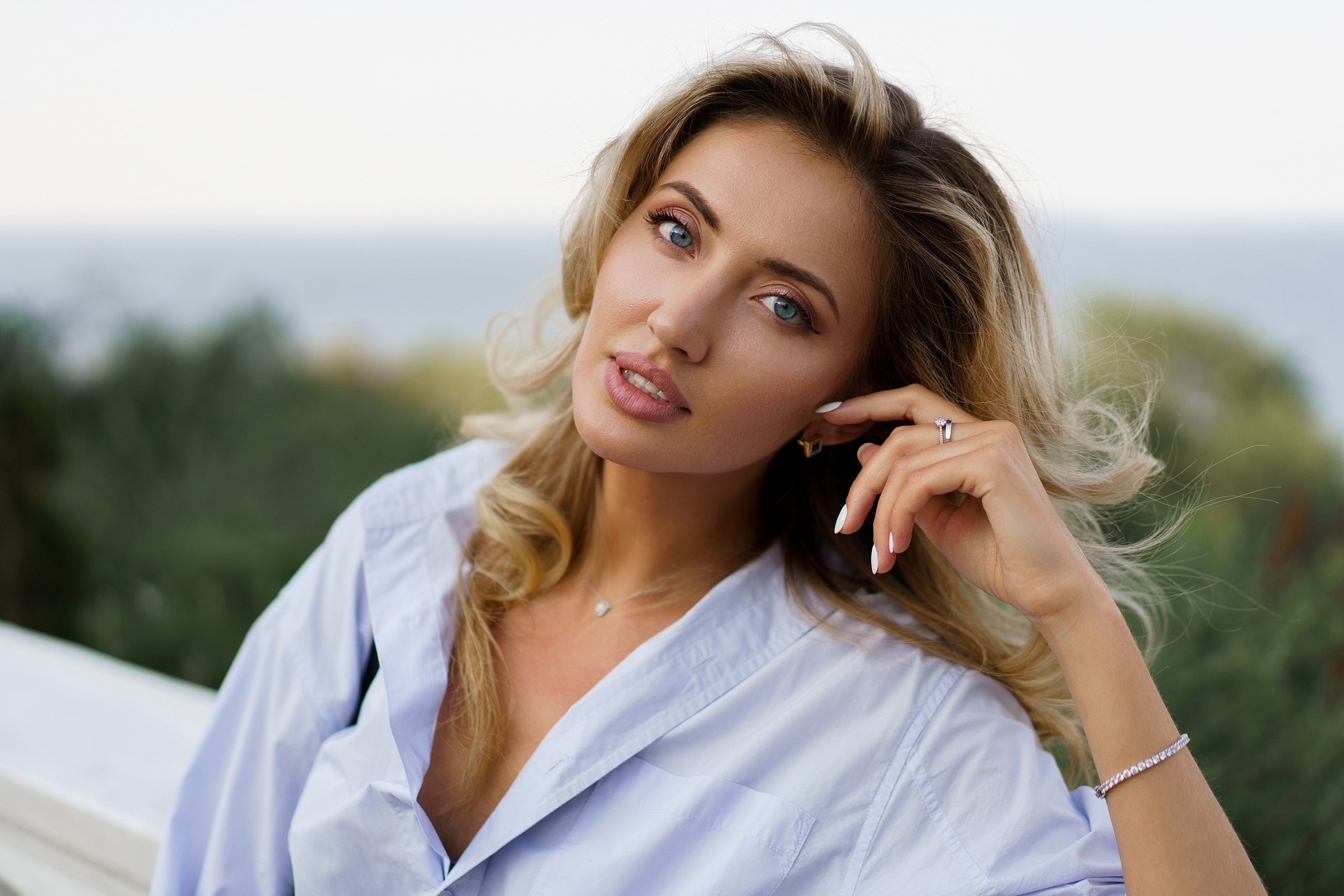 Woman with light hair in outdoor setting.